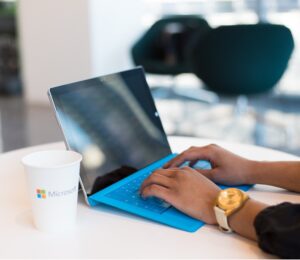 who we are Image showing person on laptop
